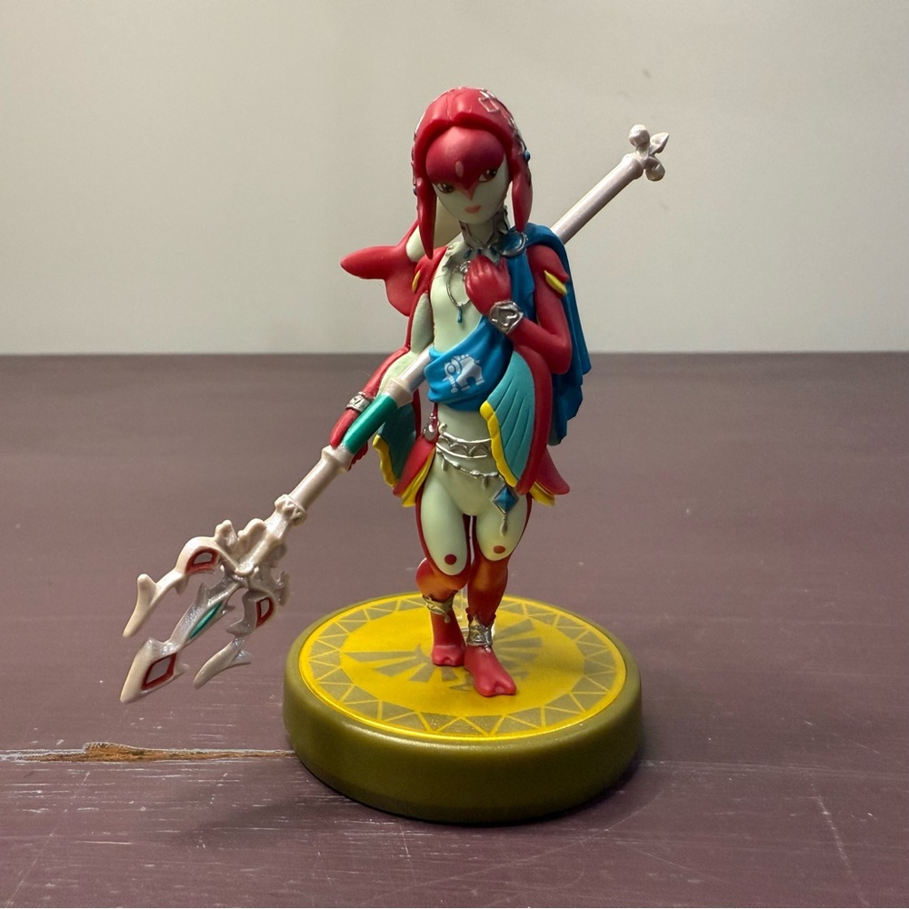 Red and White Figurine with Staff